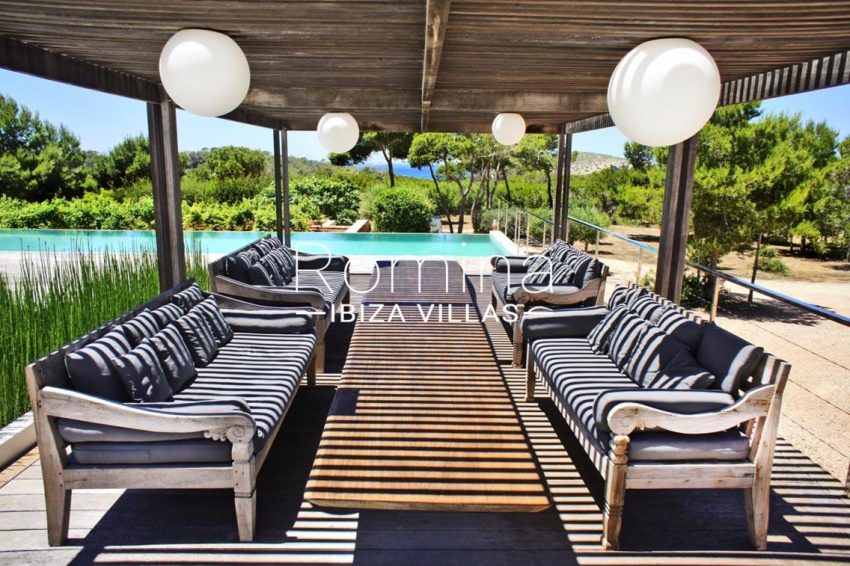 villa vallis ibiza-2pool wooden deck seating area